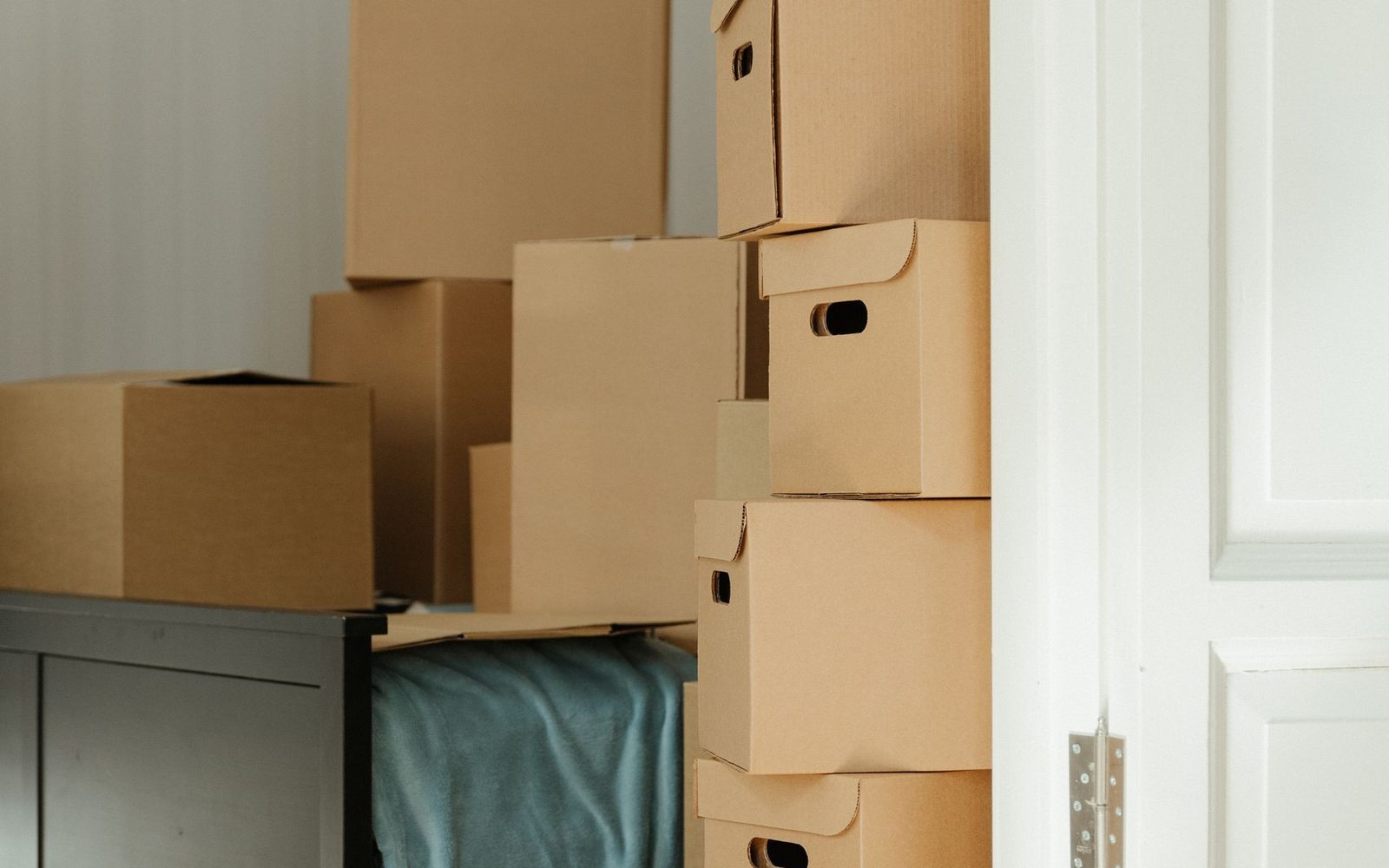 Stacked cardboard boxes during a house clearance