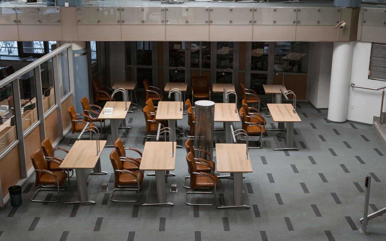 Office chairs stacked on desks during an office clearance